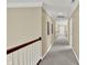 Upstairs hallway featuring neutral paint, carpeted floors, and natural light at 9690 Irishmans Run Ln, Zionsville, IN 46077