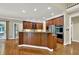 Large kitchen with island, stainless appliances and wood cabinets at 9690 Irishmans Run Ln, Zionsville, IN 46077