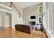 Bright living room boasts a cozy fireplace, hardwood floors, and lots of natural light at 9690 Irishmans Run Ln, Zionsville, IN 46077