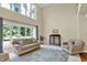 Inviting living room features two-story windows, comfortable seating, and an accent rug at 9690 Irishmans Run Ln, Zionsville, IN 46077