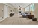 Spacious living room in finished basement featuring a fireplace and large sectional at 9690 Irishmans Run Ln, Zionsville, IN 46077