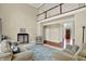 Elegant living room boasting soaring ceilings, neutral walls, and an abundance of natural light at 9690 Irishmans Run Ln, Zionsville, IN 46077