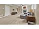Bright basement living room with fireplace, large sectional, and ample windows at 9690 Irishmans Run Ln, Zionsville, IN 46077