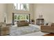 This spacious living room offers natural light, high ceilings, and plush seating making it ideal for relaxation at 9690 Irishmans Run Ln, Zionsville, IN 46077