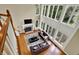 Aerial view of the living room featuring a fireplace and two-story window at 9690 Irishmans Run Ln, Zionsville, IN 46077
