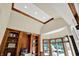 Office with custom shelving, tray ceiling, large bay window, and sophisticated design at 9690 Irishmans Run Ln, Zionsville, IN 46077