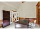 Office featuring custom built-in shelves, a large wooden desk, and white office chair at 9690 Irishmans Run Ln, Zionsville, IN 46077