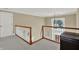 Bright and airy landing with a decorative window and staircase view at 9690 Irishmans Run Ln, Zionsville, IN 46077