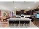 Beautiful kitchen features a center island, stainless steel appliances, and dark wood cabinets at 9806 Olympic Blvd, Pendleton, IN 46064