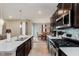 Beautiful kitchen features stainless steel appliances, white countertops, and dark wood cabinets at 9806 Olympic Blvd, Pendleton, IN 46064