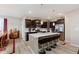 Beautiful kitchen features a center island, stainless steel appliances, and dark wood cabinets at 9806 Olympic Blvd, Pendleton, IN 46064