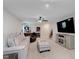 Spacious living room with plush seating, a ceiling fan, and a modern entertainment center at 9806 Olympic Blvd, Pendleton, IN 46064