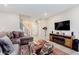 Cozy living room with comfortable sectional sofa and entertainment center at 9806 Olympic Blvd, Pendleton, IN 46064