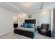 Main bedroom featuring a tray ceiling, ensuite bath, and plenty of natural light at 9806 Olympic Blvd, Pendleton, IN 46064