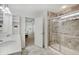 Bright bathroom featuring double vanity, modern fixtures, and a glass-enclosed shower at 10107 Landis Blvd, Fishers, IN 46040