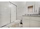 Compact bathroom with walk-in shower, granite countertop vanity, and modern fixtures at 10107 Landis Blvd, Fishers, IN 46040