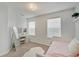 Bright bedroom featuring a vanity area and ample natural light, creating a serene and inviting space at 10107 Landis Blvd, Fishers, IN 46040