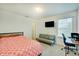Comfortable bedroom with a modern bed, sofa, and a desk, perfect for a relaxed and productive living space at 10107 Landis Blvd, Fishers, IN 46040