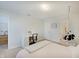 Bedroom with a hanging chair and a vanity desk in a bright space with neutral decor at 10107 Landis Blvd, Fishers, IN 46040