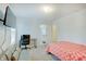 Bedroom with a modern bed, sofa, and desk, complemented by natural light and a sleek TV at 10107 Landis Blvd, Fishers, IN 46040