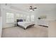 Spacious bedroom features tray ceilings, carpet floors, many windows, and a ceiling fan with lighting at 10107 Landis Blvd, Fishers, IN 46040