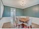 Elegant dining room featuring a round table, four chairs, colorful rug, and chandelier at 10107 Landis Blvd, Fishers, IN 46040