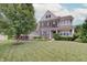 Charming two-story home with brick and siding, black shutters, landscaping, and a lush green lawn at 10107 Landis Blvd, Fishers, IN 46040