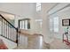 Inviting two-story foyer with hardwood floors, staircase, and abundant natural light at 10107 Landis Blvd, Fishers, IN 46040