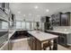 Beautiful kitchen featuring a large island, stainless appliances, plenty of counter space, and wood flooring at 10107 Landis Blvd, Fishers, IN 46040
