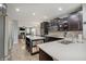 Gourmet kitchen with stainless steel appliances, dark cabinets, a large island, and an eat-in nook at 10107 Landis Blvd, Fishers, IN 46040