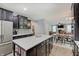 Expansive kitchen with a huge center island, bar stool seating, ample cabinet space, and stainless appliances at 10107 Landis Blvd, Fishers, IN 46040
