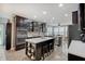 Spacious kitchen boasts a large island, stainless steel appliances, and a modern design with wood-look floors at 10107 Landis Blvd, Fishers, IN 46040