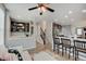Open-concept living space with a built-in office, bar seating, and a seamless flow to the kitchen at 10107 Landis Blvd, Fishers, IN 46040