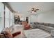 Sun-drenched living room with a stylish area rug, comfortable seating, and an open view to the dining area at 10107 Landis Blvd, Fishers, IN 46040