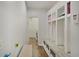 Well-organized mudroom with built-in storage, bench seating, and hooks for convenient entry and exit at 10107 Landis Blvd, Fishers, IN 46040