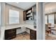 Inviting office space with custom built-in shelving and cabinets, granite countertops, and neutral walls at 10107 Landis Blvd, Fishers, IN 46040