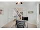 Functional home office featuring a desk, chair, and natural light streaming through white french doors at 10107 Landis Blvd, Fishers, IN 46040