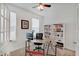 Bright home office with neutral carpet, white bookshelves, and ample natural light at 10107 Landis Blvd, Fishers, IN 46040