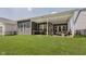 Well-maintained backyard with a large covered patio, providing an excellent space for outdoor living and entertaining at 10725 Crum Ct, Fishers, IN 46037