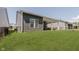 Expansive backyard featuring a covered patio and lush green lawn, ideal for outdoor activities and gatherings at 10725 Crum Ct, Fishers, IN 46037