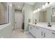 Bathroom featuring double sinks, modern vanity, and large mirrors at 10725 Crum Ct, Fishers, IN 46037