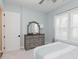 Inviting bedroom with a large dresser and a serene atmosphere created by the natural light and calming colors at 10725 Crum Ct, Fishers, IN 46037