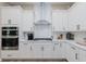 Bright kitchen with stainless steel appliances and white cabinets at 10725 Crum Ct, Fishers, IN 46037