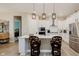Bright kitchen with a large island, stainless steel appliances, and white cabinets at 10725 Crum Ct, Fishers, IN 46037