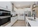 Well-lit kitchen featuring stainless steel appliances and updated cabinets at 10725 Crum Ct, Fishers, IN 46037