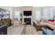Warm living room showcases a fireplace, stylish decor, and plush seating, creating a cozy space at 10725 Crum Ct, Fishers, IN 46037