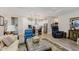 Open concept living room with kitchen view, showcasing a modern design with ample seating and lighting at 10725 Crum Ct, Fishers, IN 46037