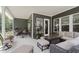 Cozy covered patio with comfortable seating, perfect for outdoor entertaining and relaxation at 10725 Crum Ct, Fishers, IN 46037