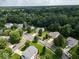 An aerial view showcases this beautiful neighborhood surrounded by lush trees and well-maintained landscaping at 1119 Albemarle Cir, Noblesville, IN 46062