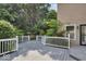 This large backyard deck overlooks lush trees, perfect for outdoor entertaining at 1119 Albemarle Cir, Noblesville, IN 46062